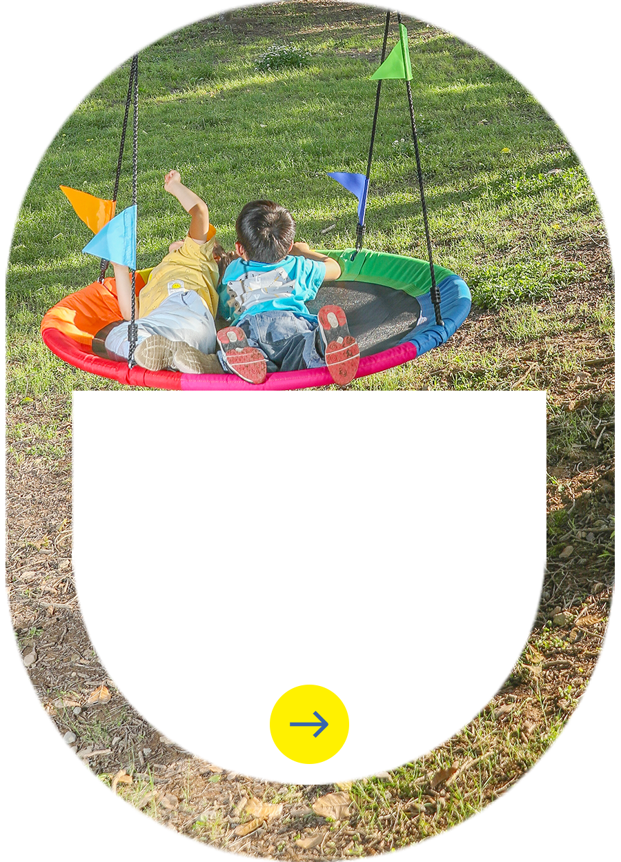 Kids enjoying custom nest swing with rainbow colors - ODM playground equipment by Zoshine