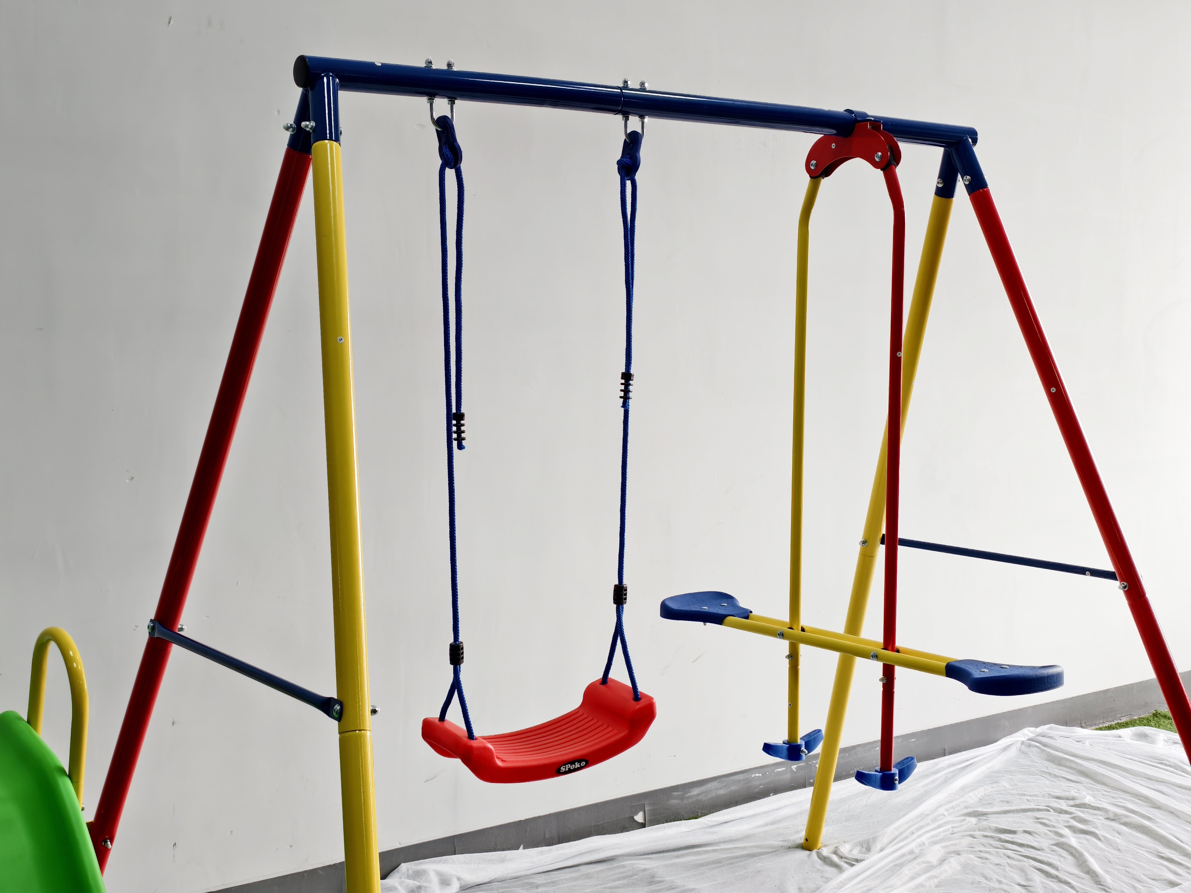 Durable outdoor slide and swing set installed in a backyard